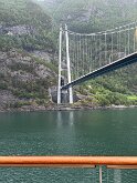 035 Passing under a bridge on the fjord. Note how the road ends in a tunnel.