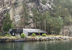 071 A restaurant on the edge of the water below a cliff in the Lysefjord where we stopped for coffee.